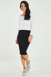 Model Katie wearing size 10 of the Alicia Midi Skirt in colour Black (Black), from the front, showing the whole outfit