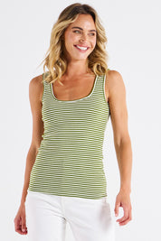 A model wearing the Emma Cotton Scoop Tank in colour Avocadostr (Green), from the front, cropped image