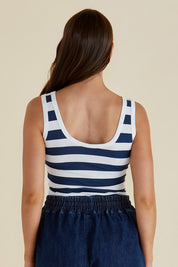 A model wearing the Emma Cotton Scoop Tank in colour Nboldstrip (Blue), from the back