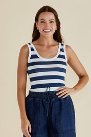 A model wearing the Emma Cotton Scoop Tank in colour Nboldstrip (Blue), from the front, cropped image