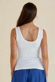 A model wearing the Emma Cotton Scoop Tank in colour White (White), from the back