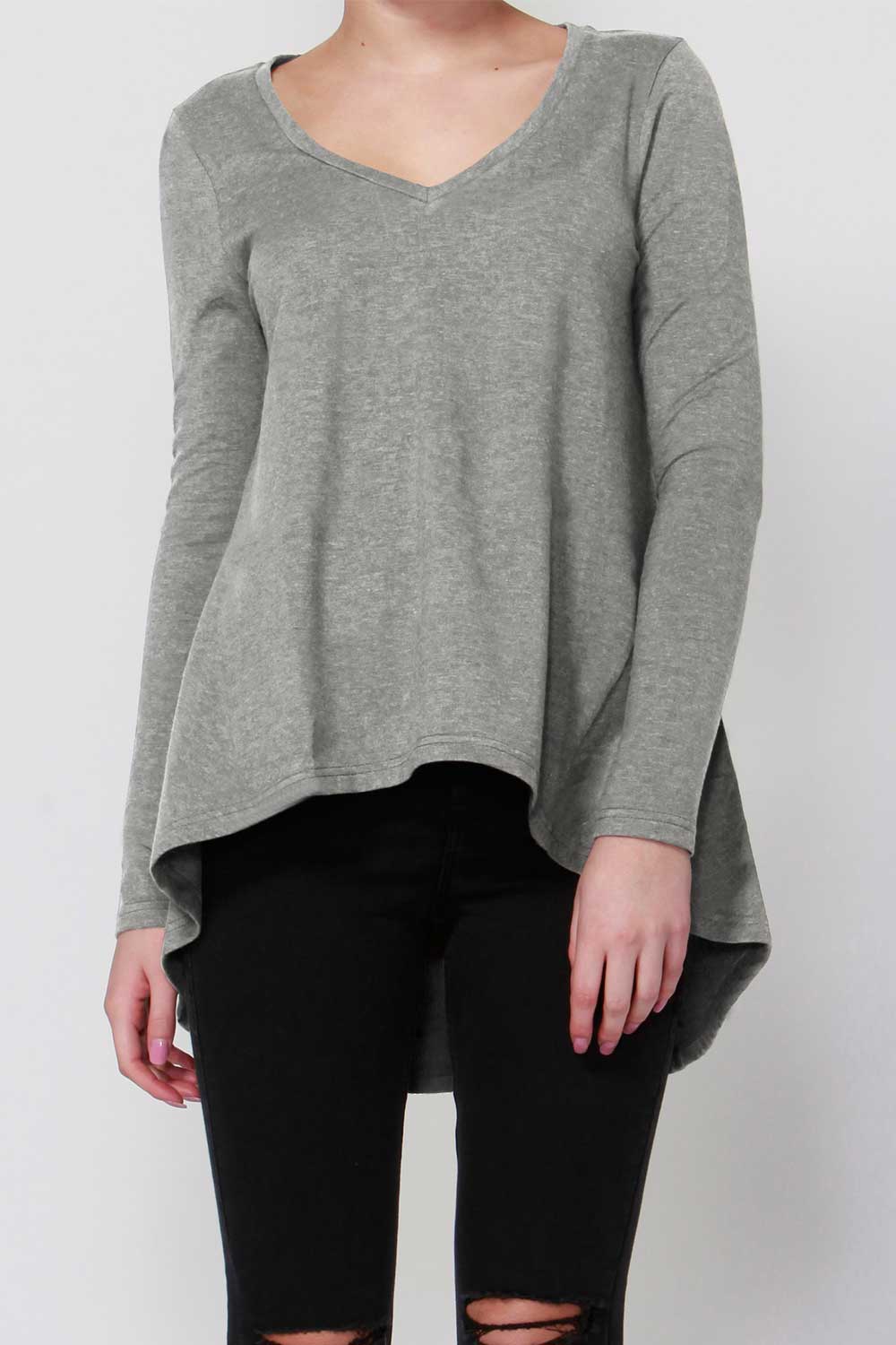 A model wearing the Melanie Swing Top in colour SilverMarl (Grey), from the front, cropped image