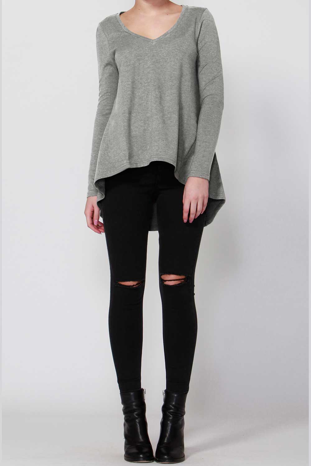 A model wearing the Melanie Swing Top in colour SilverMarl (Grey), from the front, showing the whole outfit
