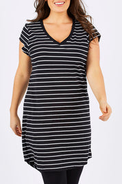 Model Tia wearing size 14 of the Ava Dress in colour BlackWhite (Black), from the front, cropped image