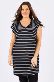 Model Tia wearing size 14 of the Ava Dress in colour BlackWhite (Black), from the front, cropped image