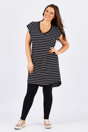 Model Tia wearing size 14 of the Ava Dress in colour BlackWhite (Black), from the front, showing the whole outfit
