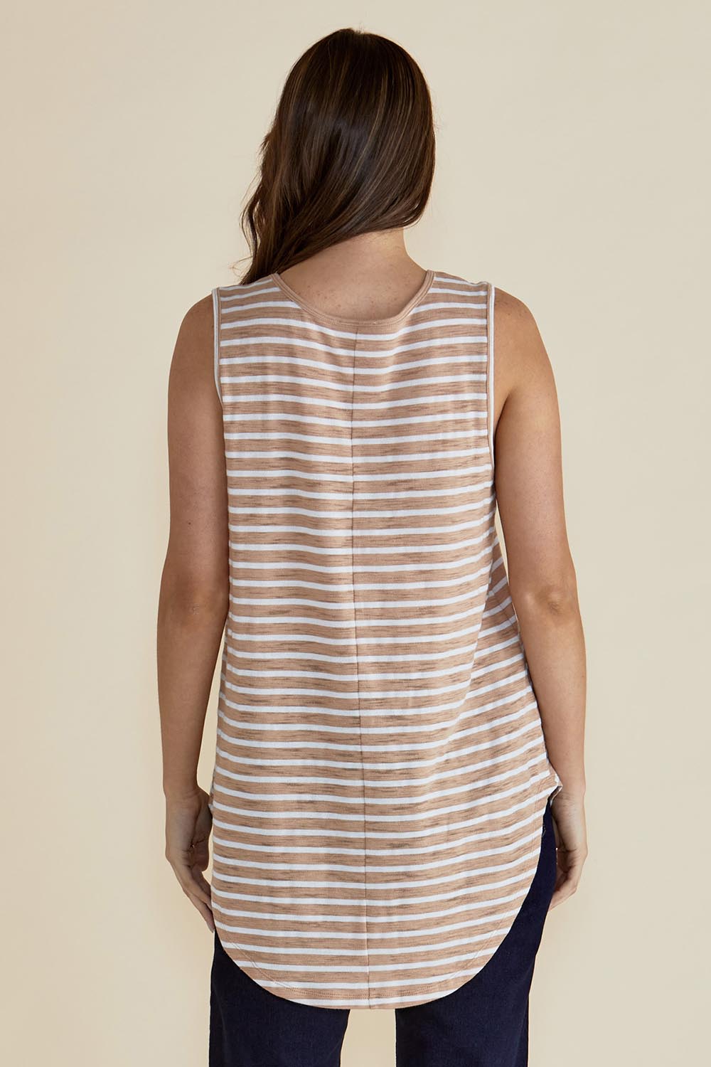 A model wearing the Keira Tank in colour Beigestrip, from the back