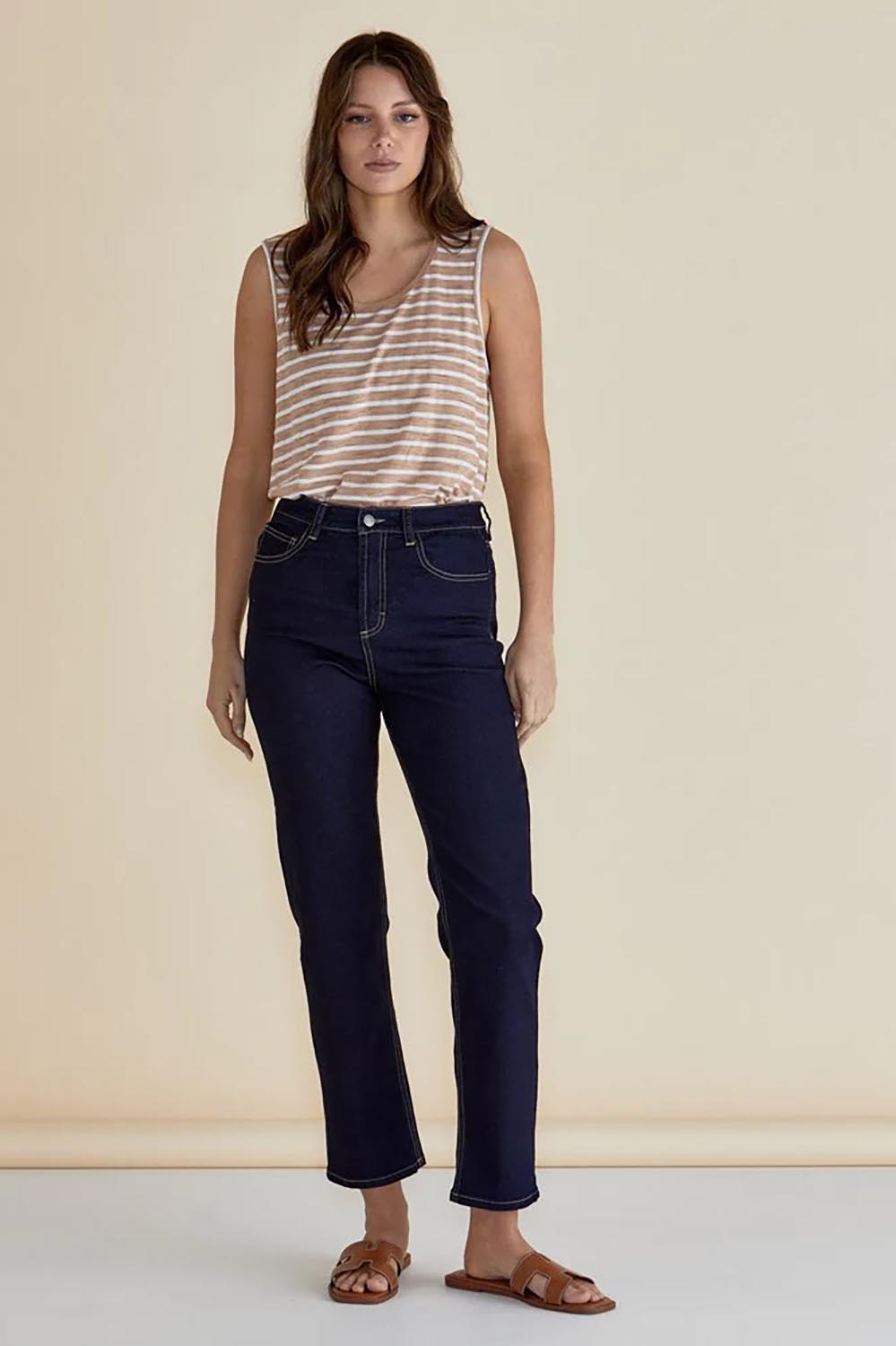 A model wearing the Keira Tank in colour Beigestrip, from the front, showing the whole outfit
