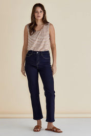 A model wearing the Keira Tank in colour Beigestrip, from the front, showing the whole outfit