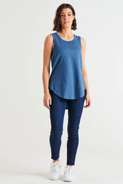 A model wearing the Keira Tank in colour Steelblue (Blue), from the front, showing the whole outfit