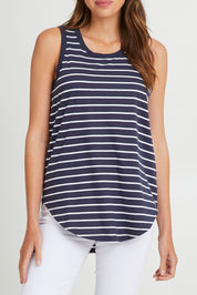 Model Madeline wearing size 10 of the Keira Tank in colour Bluestrp (Blue), from the front, cropped image