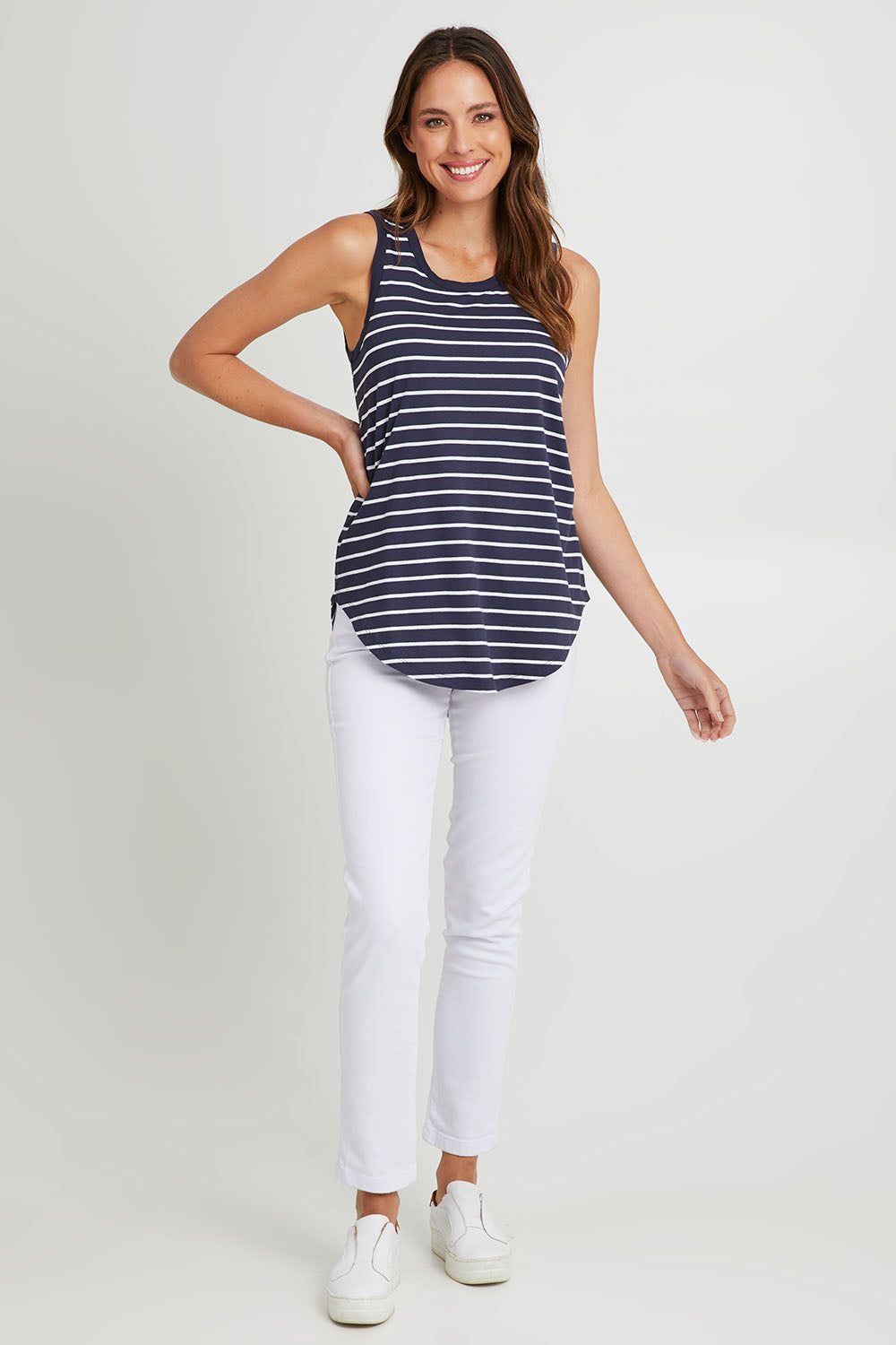 Model Madeline wearing size 10 of the Keira Tank in colour Bluestrp (Blue), from the front, showing the whole outfit