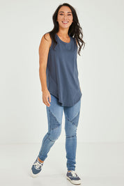Model Katie wearing size 10 of the Keira Tank in colour Indiblue (Blue), from the front, showing the whole outfit