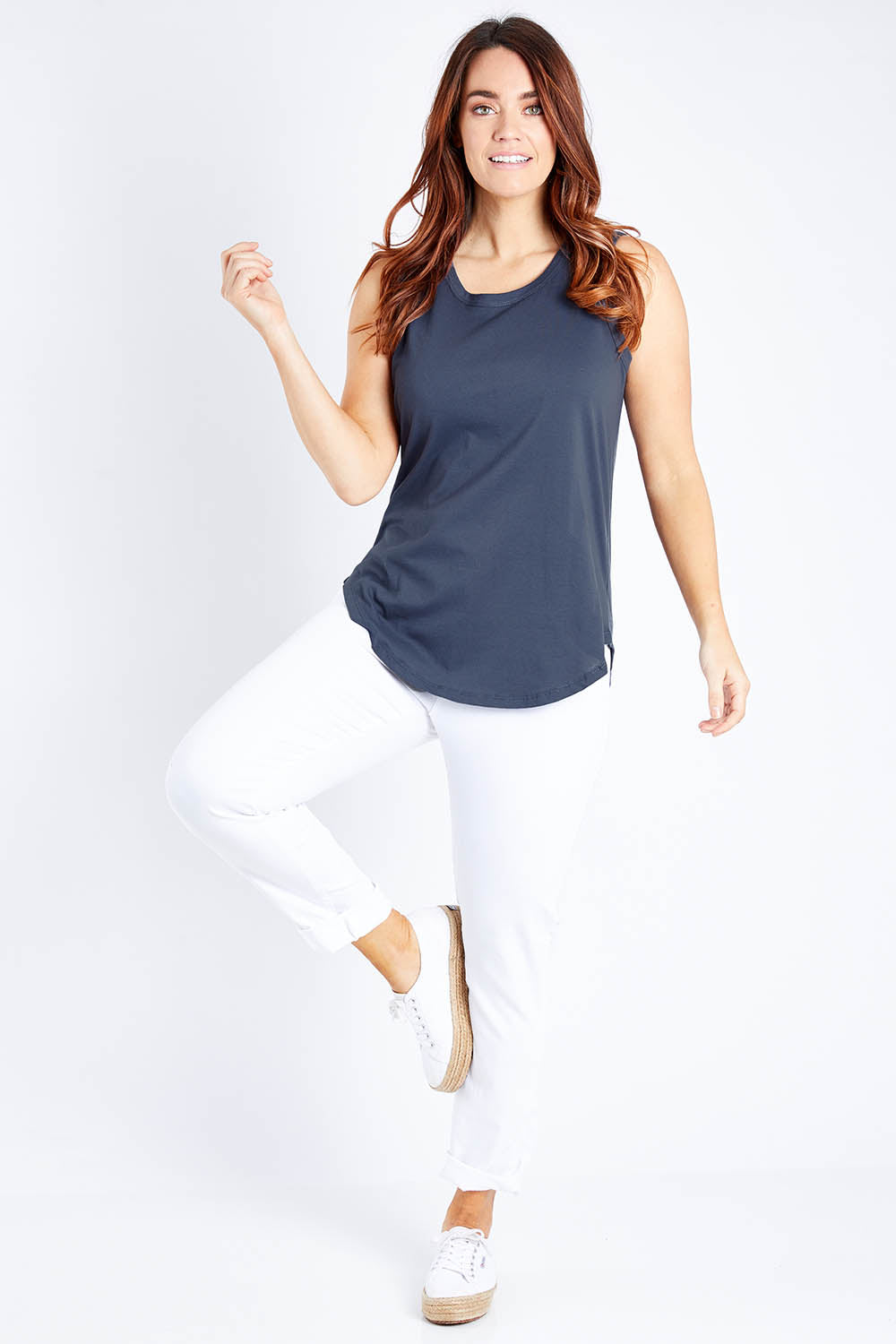Model Laura wearing size 12 of the Keira Tank in colour Indiblue (Blue), from the front, showing the whole outfit