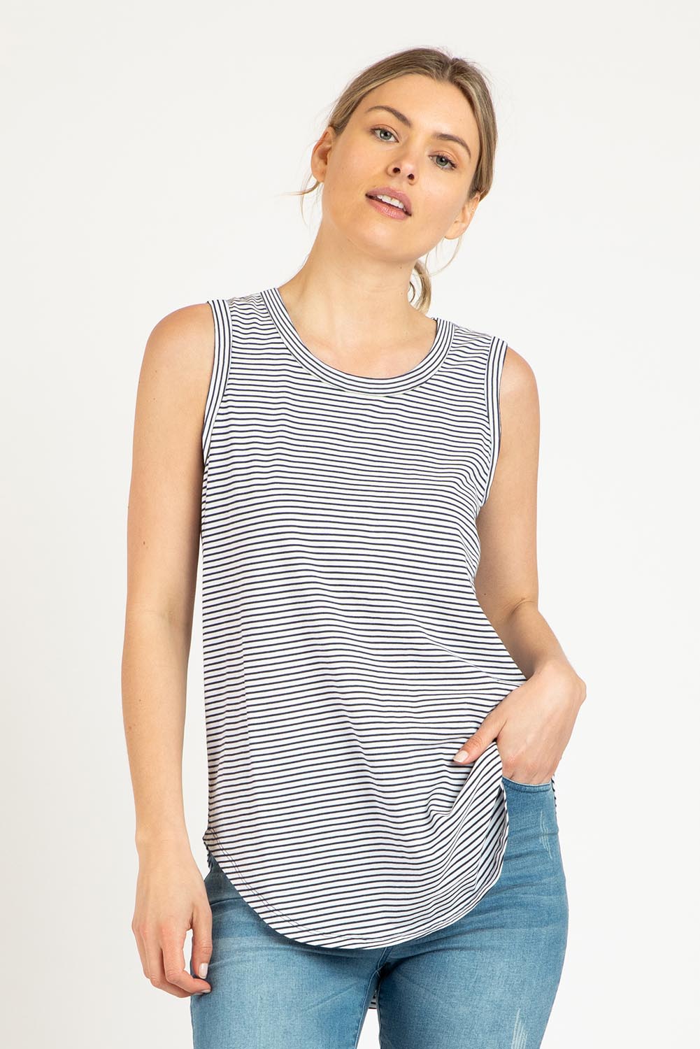 A model wearing the Keira Tank in colour Indistripe (Blue), from the front, cropped image