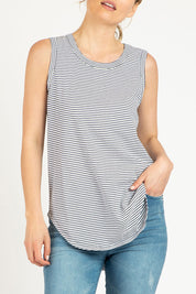 A model wearing the Keira Tank in colour Indistripe (Blue), from the front, cropped image