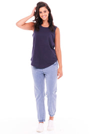 A model wearing the Keira Tank in colour Newnavy (Blue), from the front, showing the whole outfit