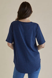 A model wearing the Ariana Cotton Tee in colour Bluestripe (Blue), from the back