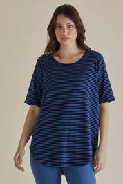 A model wearing the Ariana Cotton Tee in colour Bluestripe (Blue), from the front, cropped image