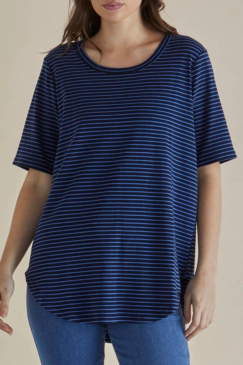 A model wearing the Ariana Cotton Tee in colour Bluestripe (Blue), from the front, cropped image