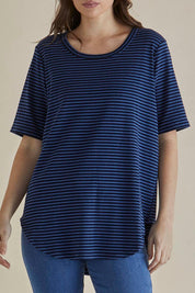 A model wearing the Ariana Cotton Tee in colour Bluestripe (Blue), from the front, cropped image