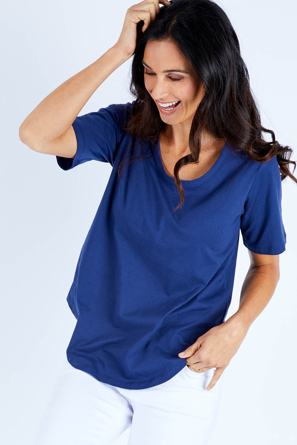 Model Gemma wearing size 10 of the Ariana Tee in colour Navy (Blue), from the front, cropped image