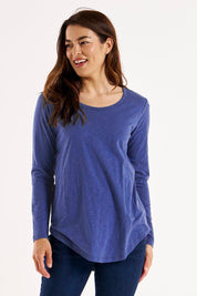 A model wearing the Megan Long Sleeve Cotton Top in colour Oceanblue (Blue), from the front, cropped image