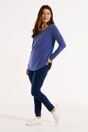 A model wearing the Megan Long Sleeve Cotton Top in colour Oceanblue (Blue), from the front, showing the whole outfit