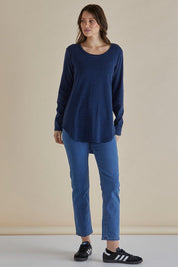 A model wearing the Megan Long Sleeve Top in colour Bluestripe (Blue), from the front, showing the whole outfit
