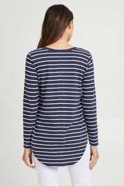 Model Madeline wearing size 10 of the Megan Long Sleeve Top in colour Bluestrp (Blue), from the back
