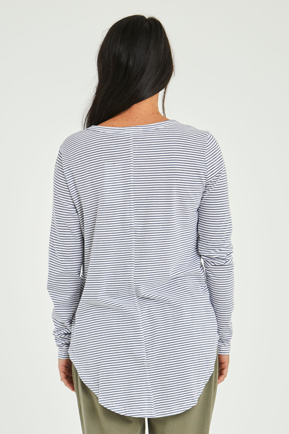 Model Katie wearing size 10 of the Megan Long Sleeve Top in colour Indistripe (Blue), from the back