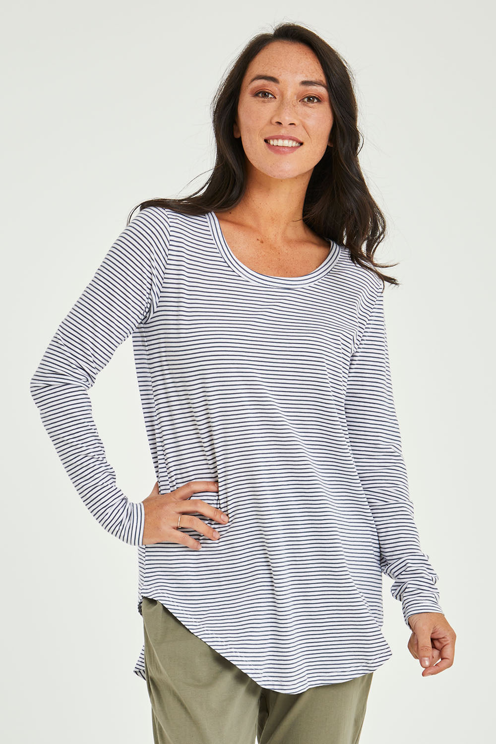 Model Katie wearing size 10 of the Megan Long Sleeve Top in colour Indistripe (Blue), from the front, cropped image