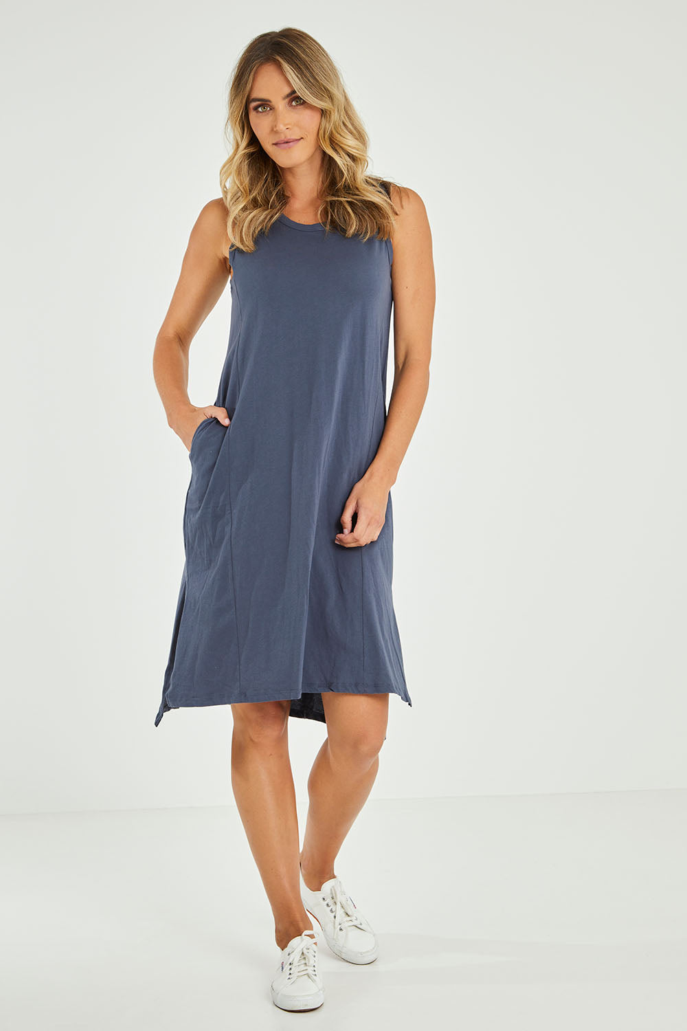 Model Alice wearing size 10 of the Arwin Dress in colour Indiblue (Blue), from the front, showing the whole outfit