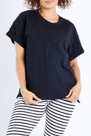 Model Lala wearing size 10 of the Boxy Tee in colour Black (Black), from the front, cropped image