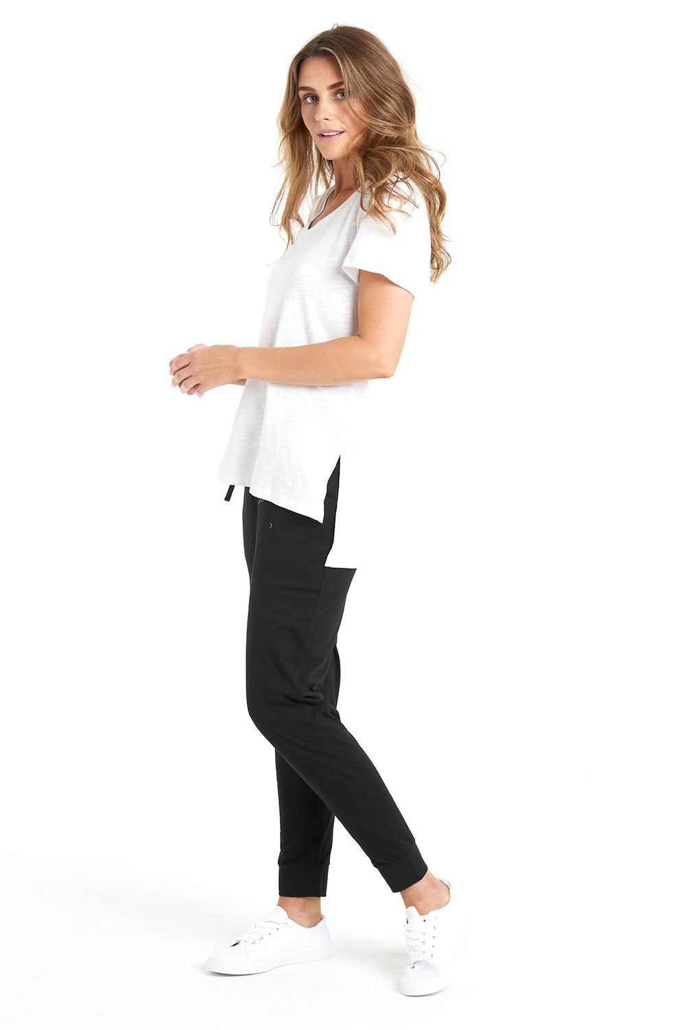 A model wearing the Billie Tee in colour White (White), from the front, showing the whole outfit