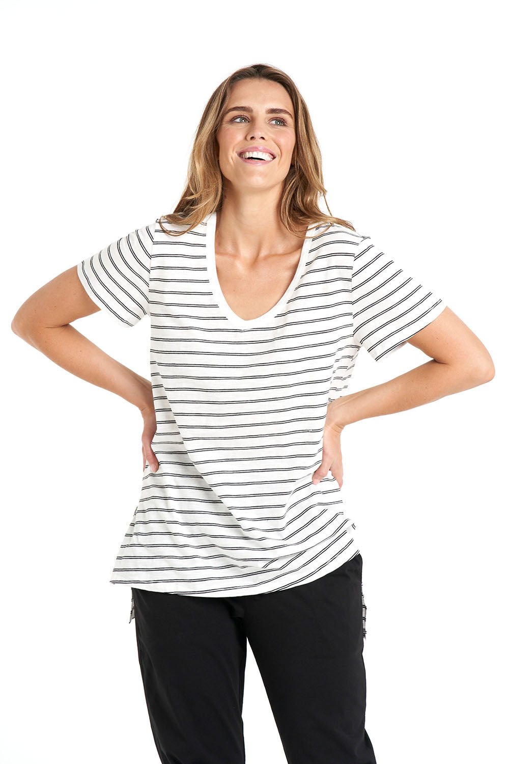 A model wearing the Billie Tee in colour Whiteblack (White), from the front, cropped image
