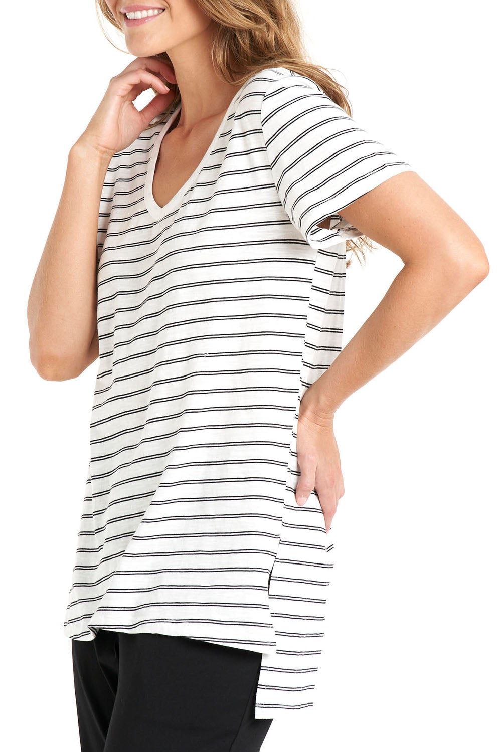 A model wearing the Billie Tee in colour Whiteblack (White), from the front, cropped image
