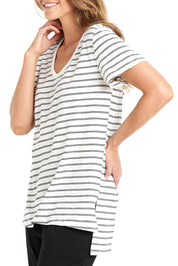 A model wearing the Billie Tee in colour Whiteblack (White), from the front, cropped image
