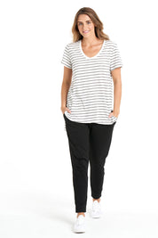 A model wearing the Billie Tee in colour Whiteblack (White), from the front, showing the whole outfit