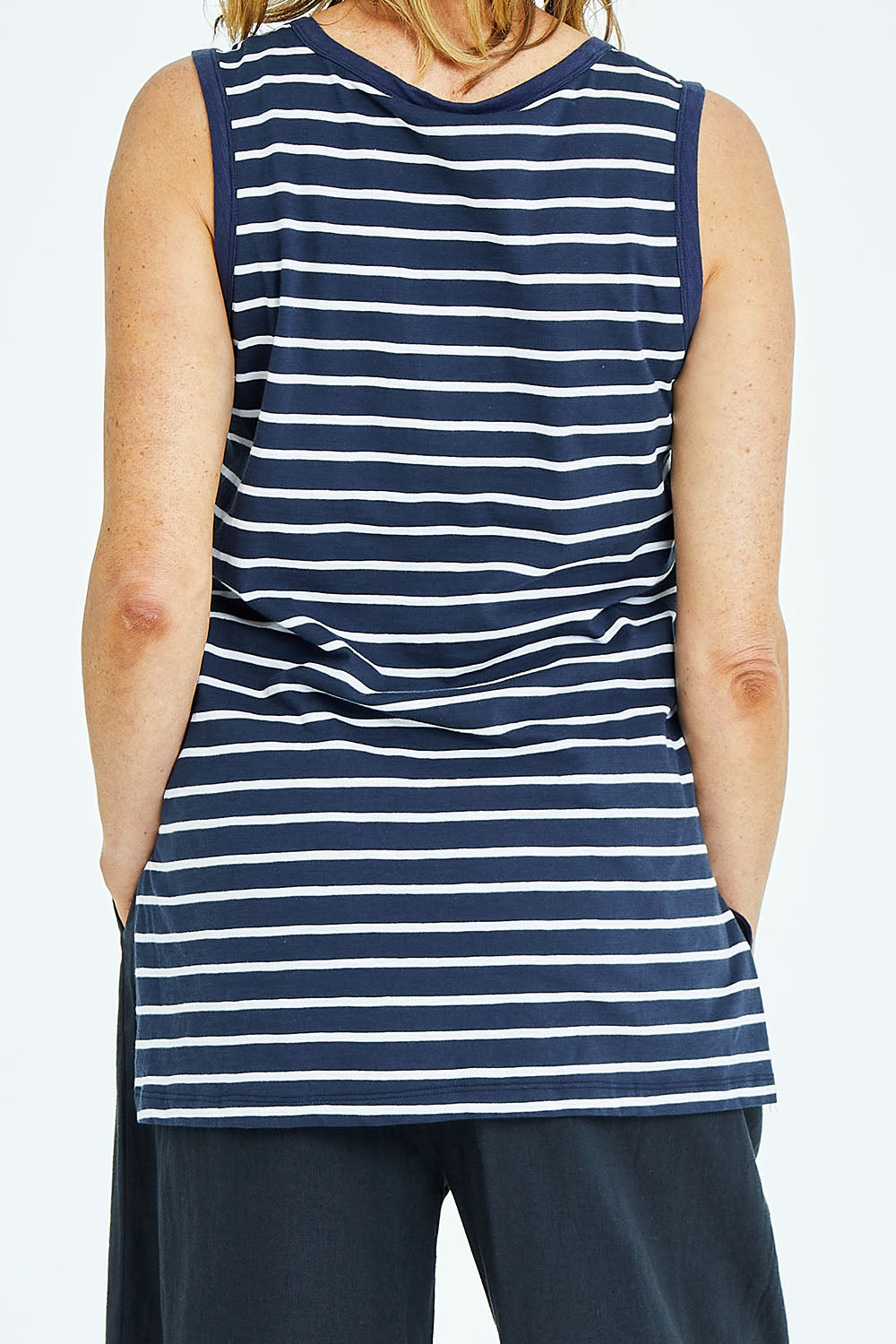 Model Naomi wearing size 10 of the Audrey Tank in colour Nautical (Blue), from the back