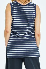 Model Naomi wearing size 10 of the Audrey Tank in colour Nautical (Blue), from the back
