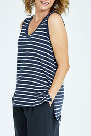 Model Naomi wearing size 10 of the Audrey Tank in colour Nautical (Blue), from the front, cropped image
