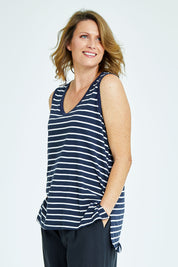 Model Naomi wearing size 10 of the Audrey Tank in colour Nautical (Blue), from the front, cropped image