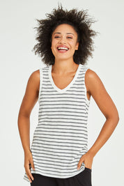 Model Olivia wearing size 10 of the Audrey Tank in colour Whiteblack (White), from the front, cropped image