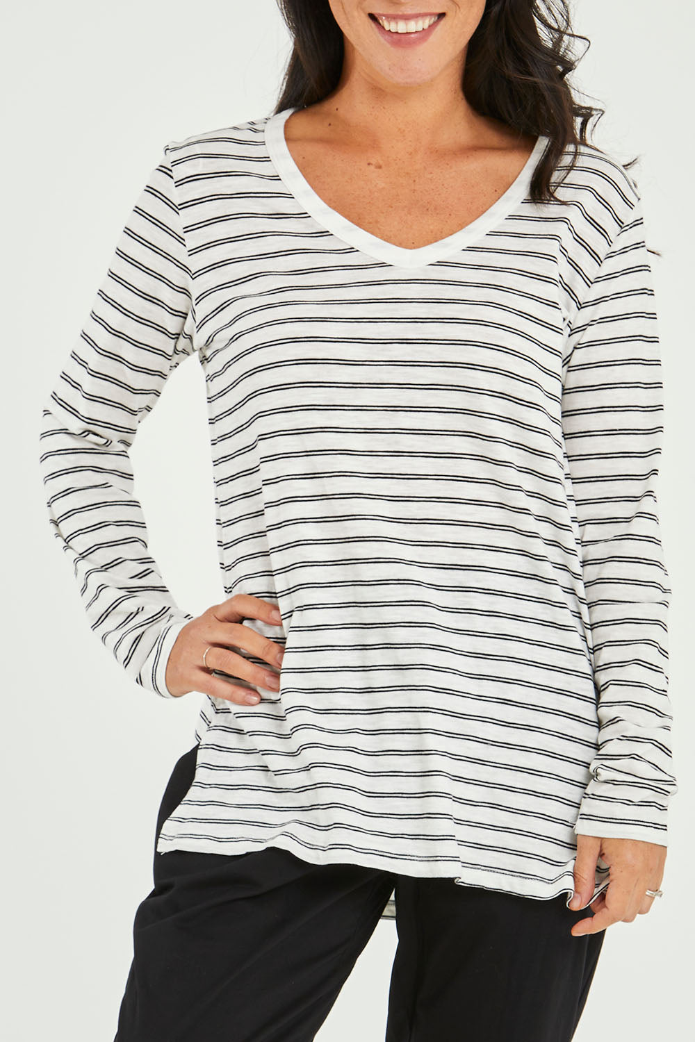 Model Katie wearing size 10 of the Bonnie Long Sleeve Top in colour Whiteblack (White), from the front, cropped image