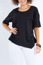 Model Lala wearing size 10 of the Florence Top in colour Black (Black), from the front, cropped image