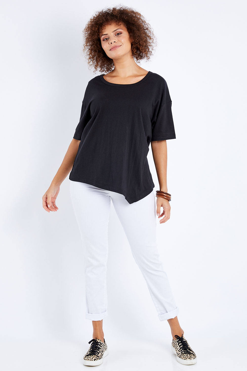 Model Lala wearing size 10 of the Florence Top in colour Black (Black), from the front, showing the whole outfit
