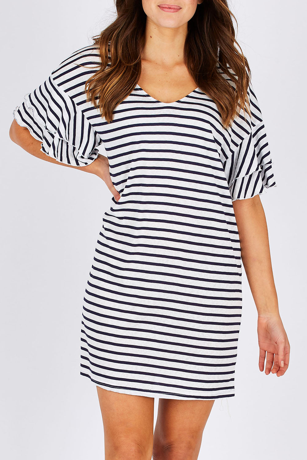 Model Madeline wearing size 10 of the Sydney Dress in colour WhiteInk (Blue), from the front, cropped image