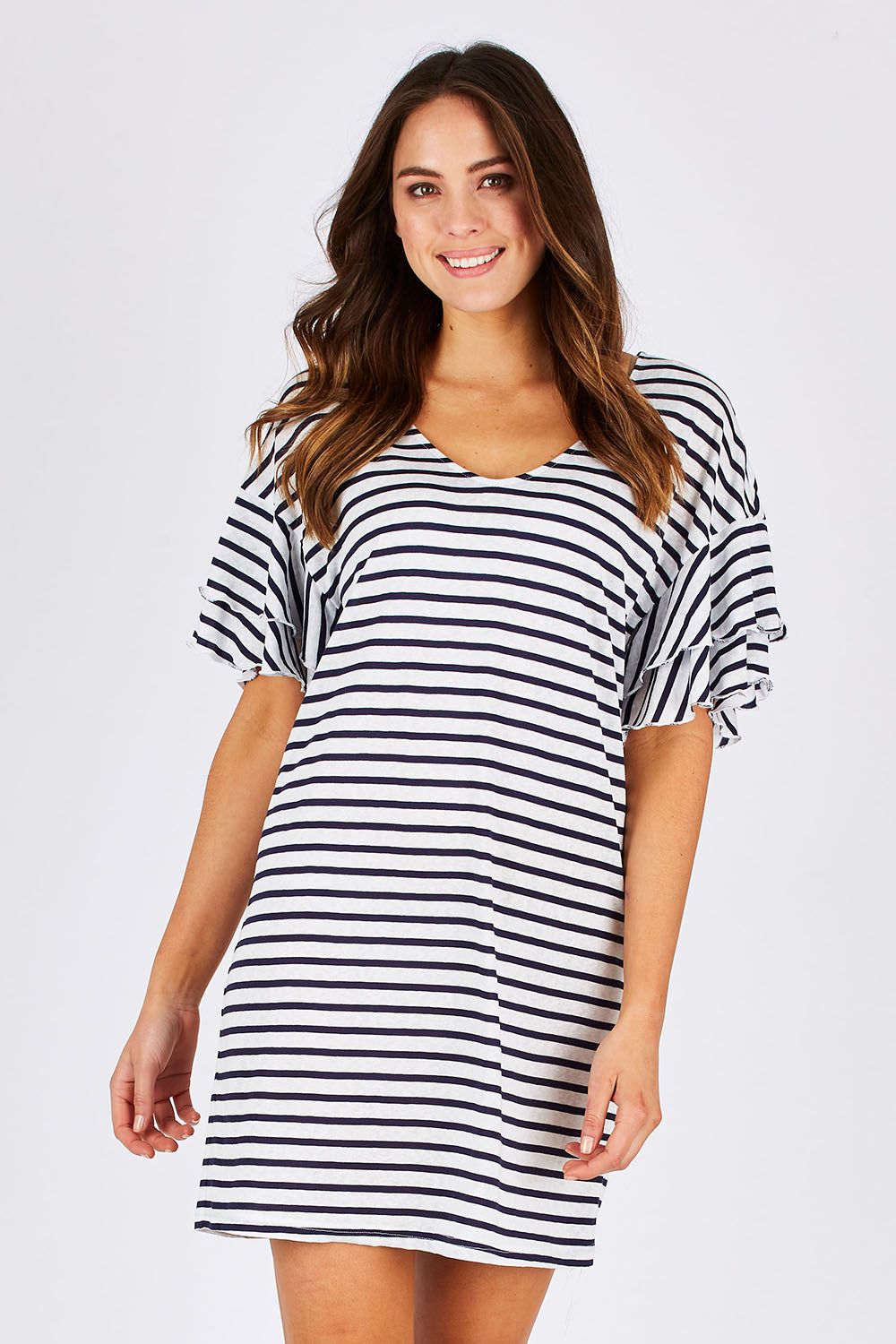 Model Madeline wearing size 10 of the Sydney Dress in colour WhiteInk (Blue), from the front, cropped image