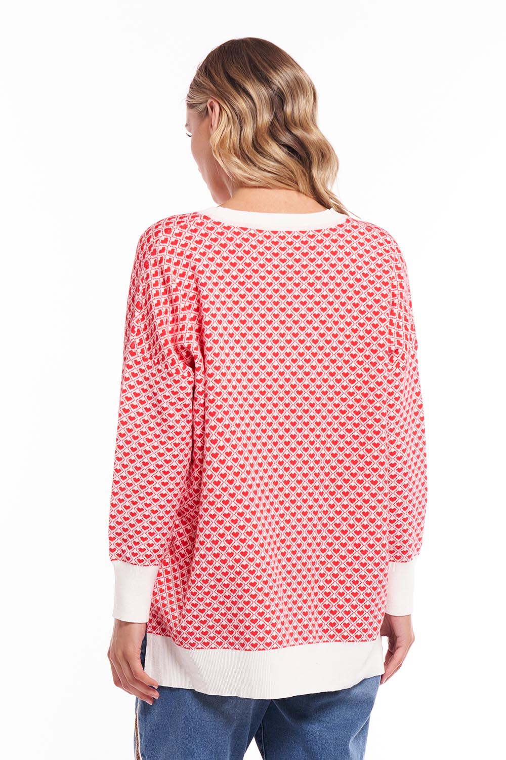 A model wearing the Gianna Sweater in colour Heart (Red), from the back